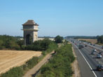 View of water tower from flyover, facing north on M40, day and night
